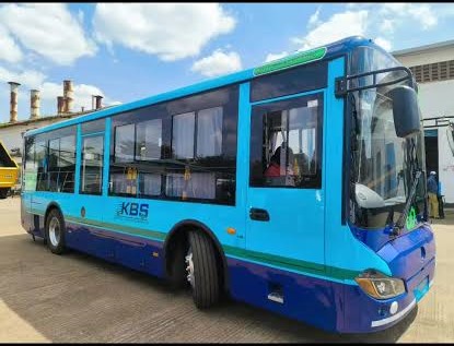 KBSM franchised city bus in cyan, navy and green livery parked at the depot